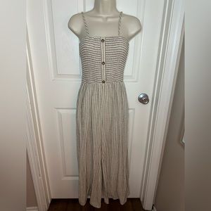 Beige/Cream romper with navy and red stripes.  Size small